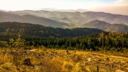 Scenic view of mountains against cloudy sky