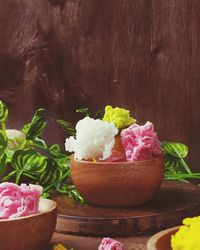 Close-up of pink roses on table