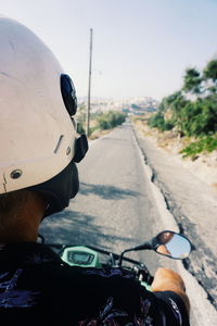 Man riding bicycle on road