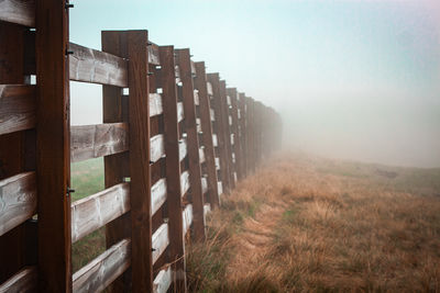 Wooden fence on field
