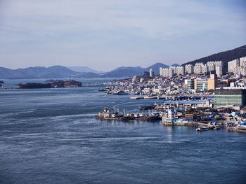 View of harbor and buildings in city