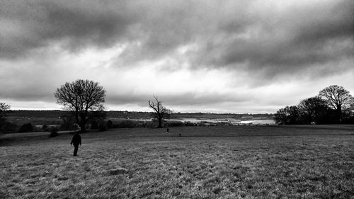 Scenic view of landscape against cloudy sky