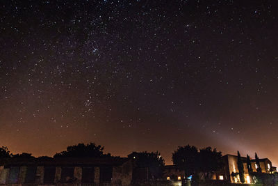 Low angle view of building against sky at night