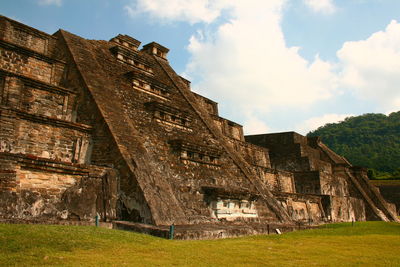 Low angle view of old ruin building against sky