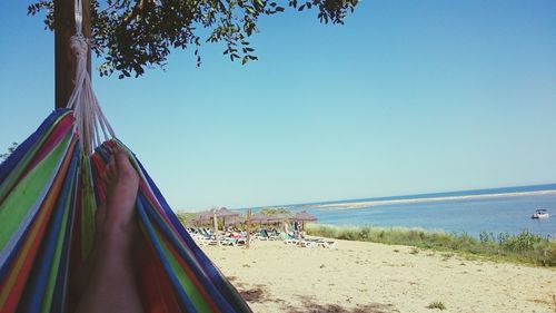 Panoramic view of beach against clear sky