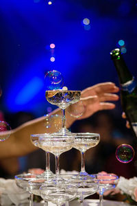 Close-up of wine glasses on table
