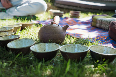 Handicraft ceramic tea bowls and clay pot. outdoor tea circle. calm and relaxing meditation 