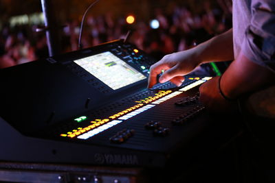 Cropped image of woman holding guitar