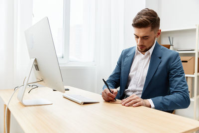 Businesswoman working on table