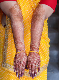 Hand decorated with amazing henna tattoo or mehndi art from flat angle