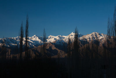 Panoramic view of mountains against clear sky