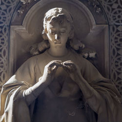 Low angle view of statue against building