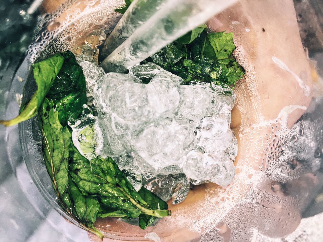 CLOSE-UP OF ICE CUBES IN WATER