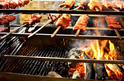 Close-up of meat on barbecue grill