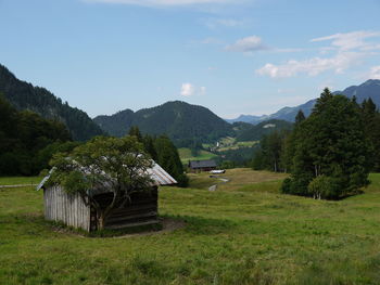 Scenic view of landscape and mountains against sky