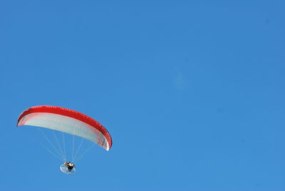 Low angle view of kite flying against clear sky