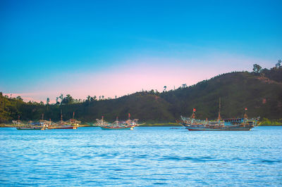 Scenic view of sea against clear blue sky