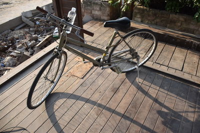 Bicycle parked by tree