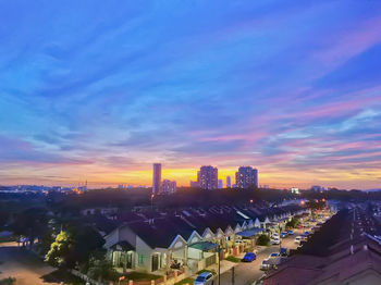 High angle view of buildings against sky during sunset