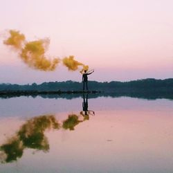 Scenic view of lake at sunset