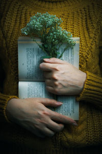 Close-up of man holding paper