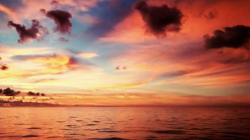 Scenic view of sea against sky at sunset