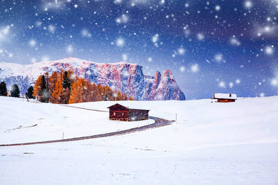 Snow covered field against sky