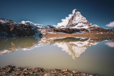 Matterhorn reflection in the theodul glacier lake, switzerland.