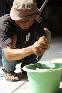 Side view of man gardening equipment