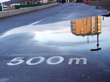 Road sign on snow in city