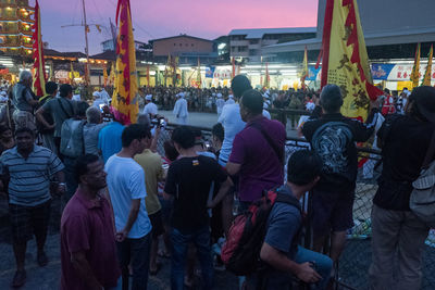 Crowd at market in city at night