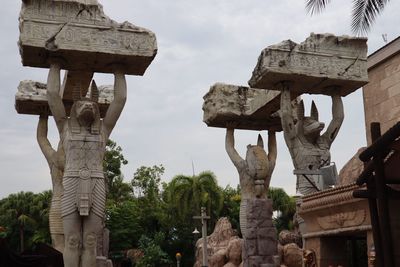 Low angle view of statue against sky