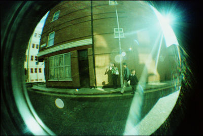 Reflection of man on glass window