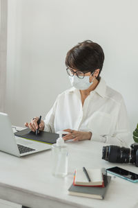 Female doctor examining patient in clinic