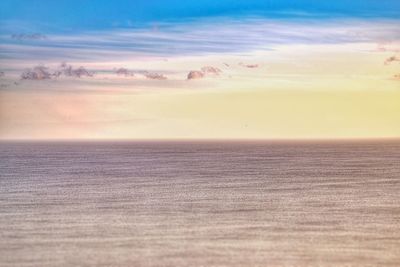 Scenic view of sea against sky at sunset