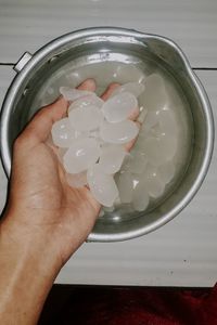 Close-up of hand holding ice cream