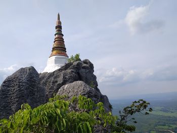 View of temple against cloudy sky