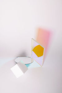 Close-up of paper flag on table against white background