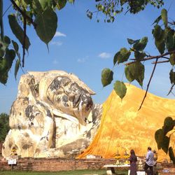 Tourists sitting on rock