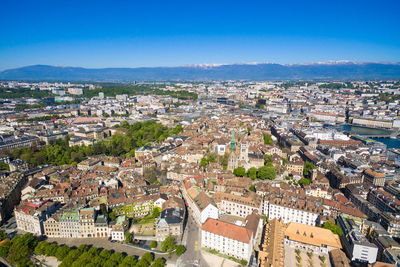 High angle view of townscape against blue sky