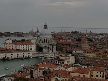 Aerial view of city buildings against sky