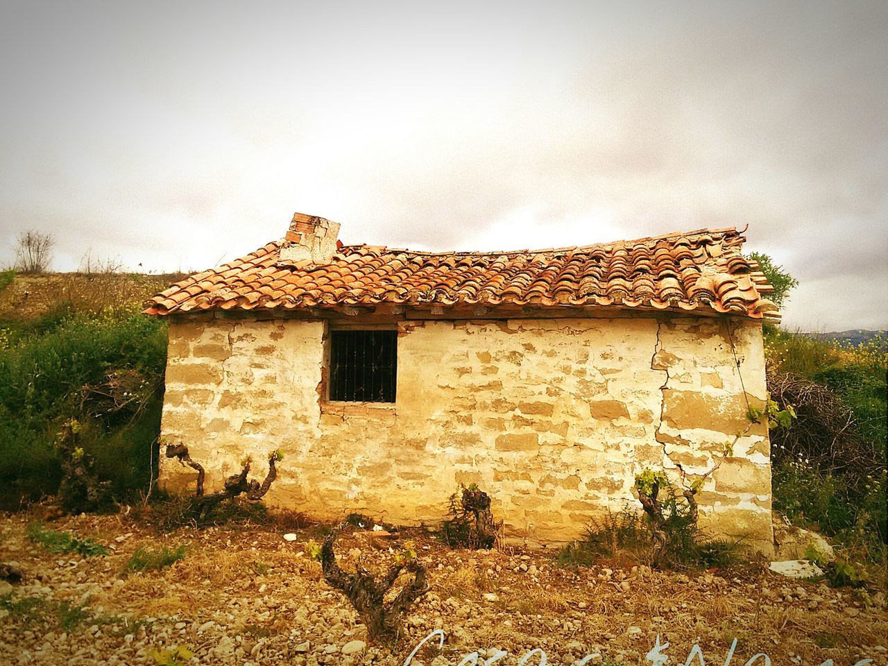 OLD HOUSE AGAINST SKY