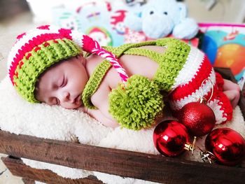 Close-up of cute baby sleeping at home