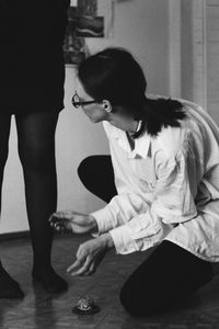 Woman sitting on table at home