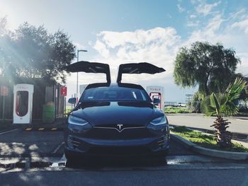 Rear view of car parked against sky