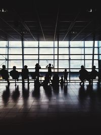 Silhouette people waiting at airport