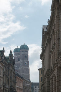 Low angle view of church against cloudy sky