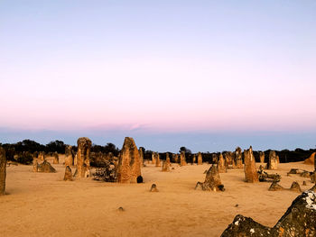 Panoramic view of desert against sky during sunset