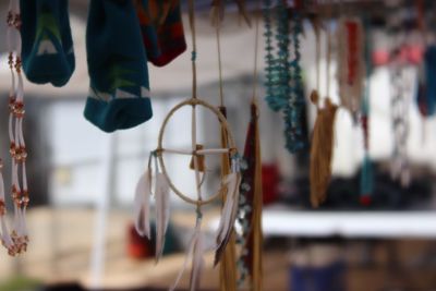 Close-up of indian art hanging on rope for sale