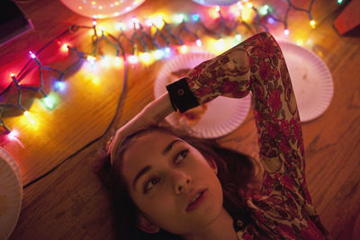 Portrait of woman photographing with mobile phone